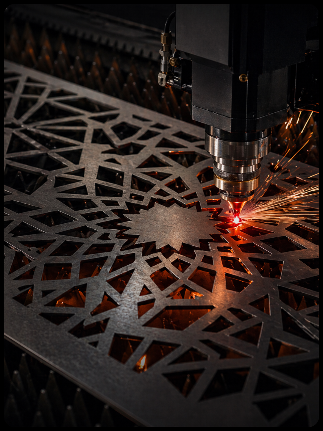 CNC fiber laser cutting machine in action with sparks